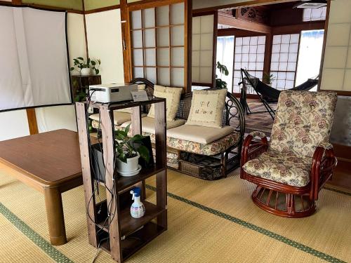 a living room with two chairs and a table at Hatake no Oyado - Vacation STAY 74494v in Takeda