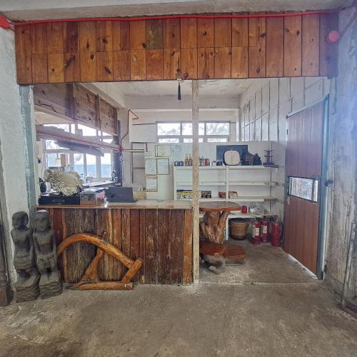 a kitchen with a wooden counter in a room at Baguio Tourist Cabin in Baguio