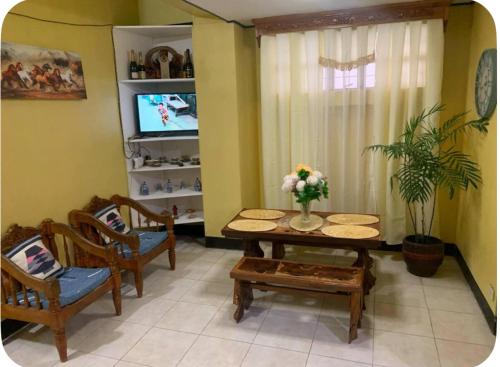 GSB City Apartelleにあるテレビまたはエンターテインメントセンター