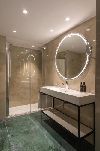 a bathroom with a sink and a mirror at Eurostars Cristal Palace in Barcelona