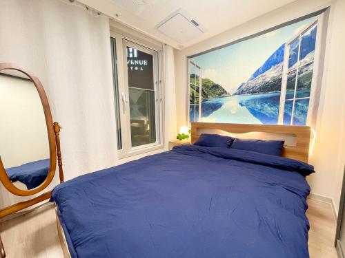 Ένα ή περισσότερα κρεβάτια σε δωμάτιο στο Luxury accommodation with Gwangalli Ocean View, gym & sauna, and free parking