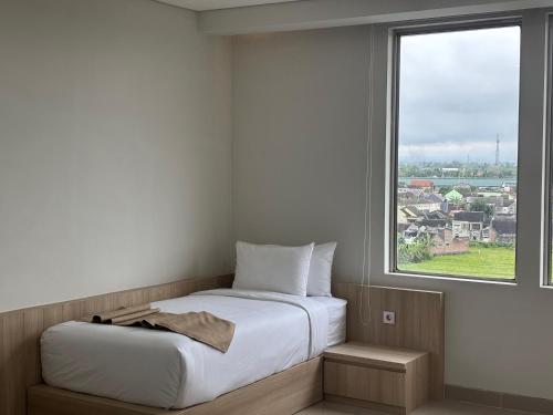 Postel nebo postele na pokoji v ubytování University Hotel UMY