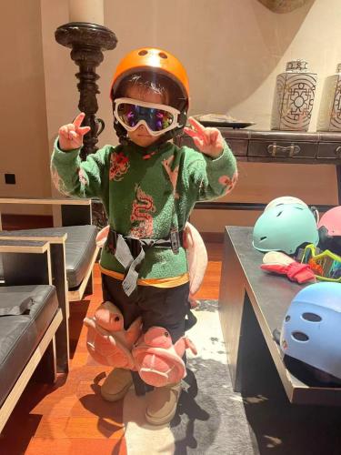 a doll wearing a helmet and goggles on a table at Yabuli QuShe Four seasons Private Lakefornt B&B in Xinhua