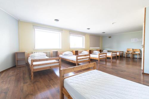 Postel nebo postele na pokoji v ubytování Kadrina Spordikeskuse Hostel