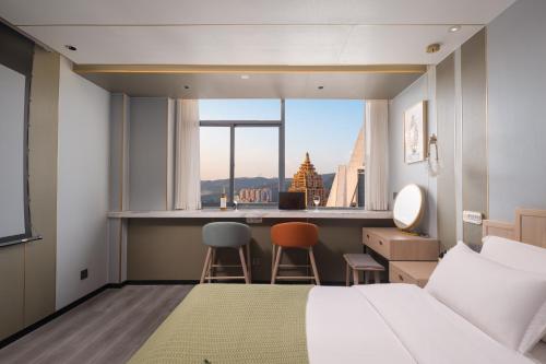 Ένα ή περισσότερα κρεβάτια σε δωμάτιο στο Bohan Shenhua Riverside Resort Hotel