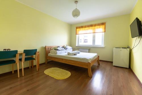 Postel nebo postele na pokoji v ubytování Kadrina Spordikeskuse Hostel