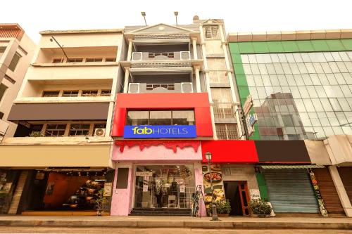 a building with a hotels sign in front of it at FabExpress Santhi Inn - 500 meters from Promenade Beach in Puducherry