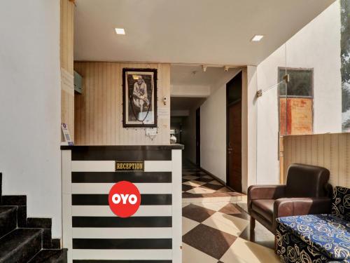 a lobby with a red yo sign on the wall at Hotel O SMS in Lucknow