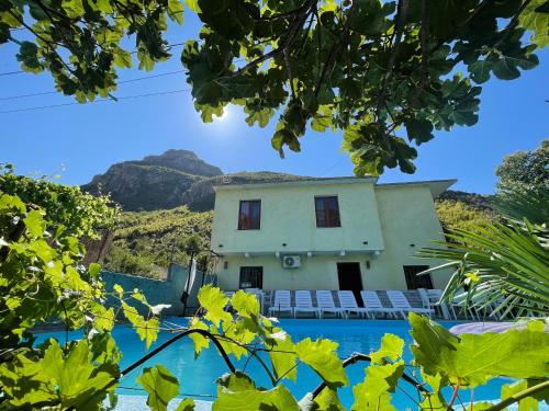 a view of the house from the pool at Domus Komanesse - Guest Houses in Koman