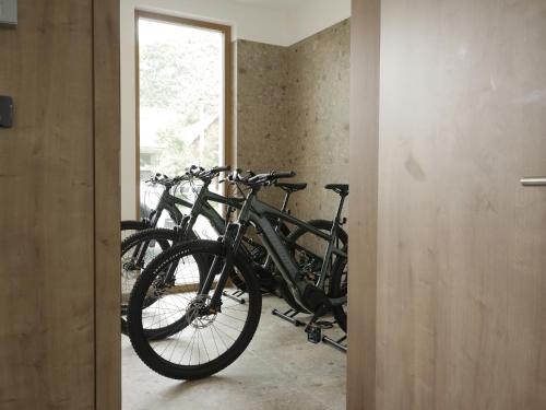 a group of bikes parked in a room at Bohinj River House in Bohinj