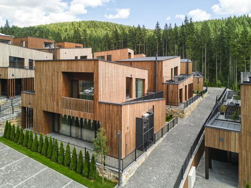 an aerial view of a row of wooden buildings at Chalet Velvet by Fomich in Palyanytsya