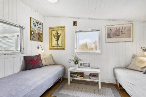 a living room with a couch and a table at LK1247-Lokken-Falkevej-3 in Løkken