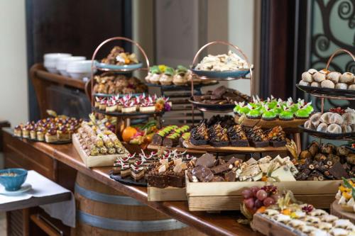 a buffet filled with lots of different types of desserts at Radisson Blu Resort & Spa, Malta Golden Sands in Mellieħa
