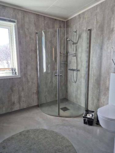 a bathroom with a shower and a sink at Mettes holiday home in Silsand