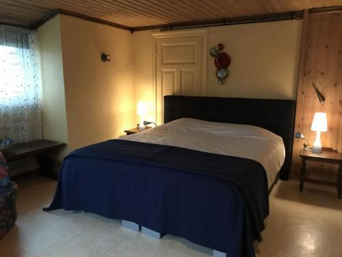 Katil atau katil-katil dalam bilik di Hoefijzergårds Guesthouse