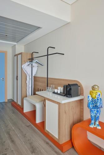 a room with a kitchen with a counter with a sink at Hyatt Centric Cairo West in Cairo