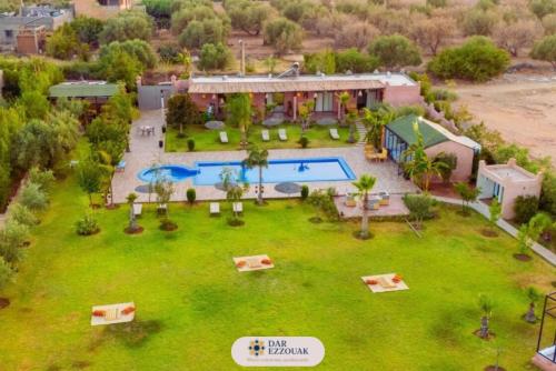 an aerial view of a resort with a swimming pool at Dar Ezzouak in Heddad