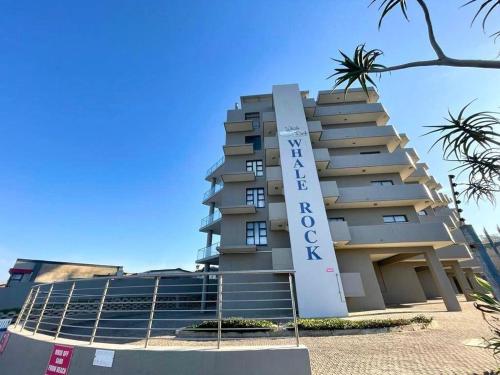 a building with a sign on the side of it at Whale Rock in Margate