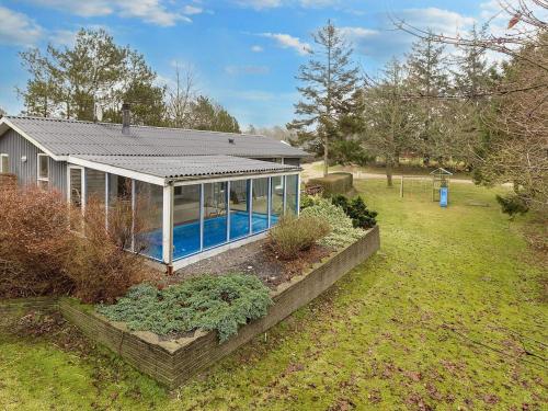 an image of a house with a swimming pool at 8 person holiday home in Farsø-By Traum in Ertebølle