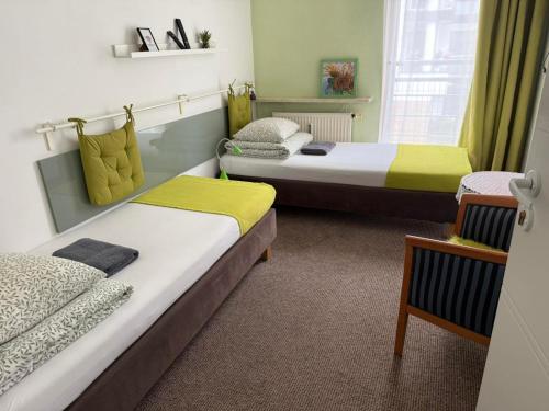 Katil atau katil-katil dalam bilik di Kolorowa Guest Rooms