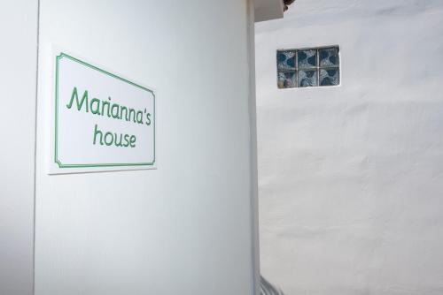 a white wall with a sign that reads matamoros house at Marianna's and Aristidis' houses in Sívros