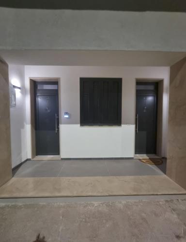 a empty room with three doors in a building at La casa di Caterina in Avetrana