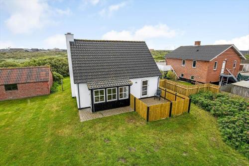 an aerial view of a house with a yard at 715-Thyboron-Limfjordsvej-17-a in Thyborøn