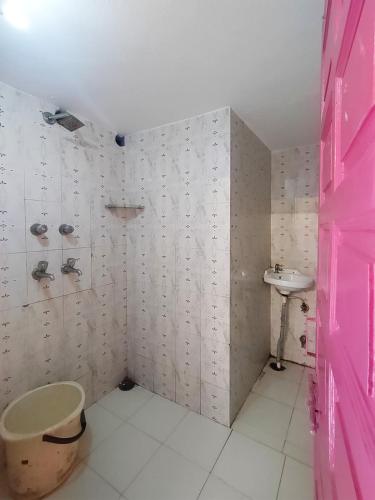a bathroom with a toilet and a sink at Hanuman Ghat Boutique Stays by Cafe Helsinki in Udaipur