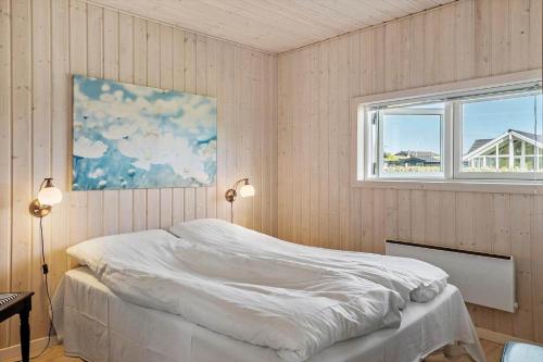 a bedroom with a white bed and a window at G139-Lemvig-Porsevej-39 in Lemvig