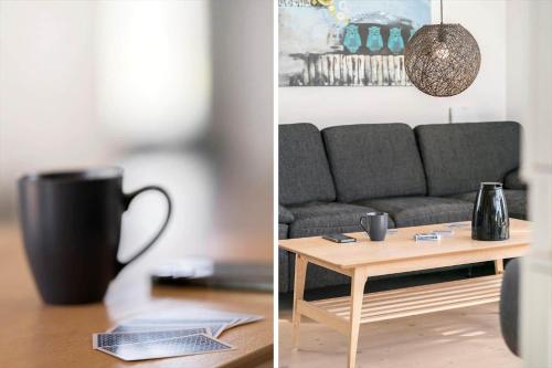 a living room with a couch and a coffee table at 509-Lemvig-Stranden-11 in Lemvig