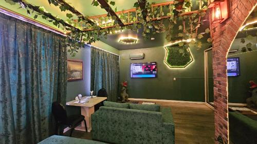 a living room with a couch and a table at City Hotel Baku in Baku