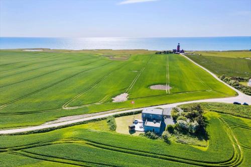an aerial view of a farm with a building in the distance at 523-Lemvig-Gammel-damsgardvej-8 in Lemvig