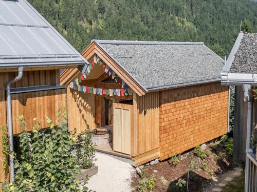 an overhead view of a wooden house with a roof at Alpegg Chalets in Waidring