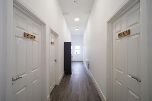 a hallway with two doors with the word abuse on them at Private & Peaceful Double Ensuite Rooms in Stapleford in Stapleford