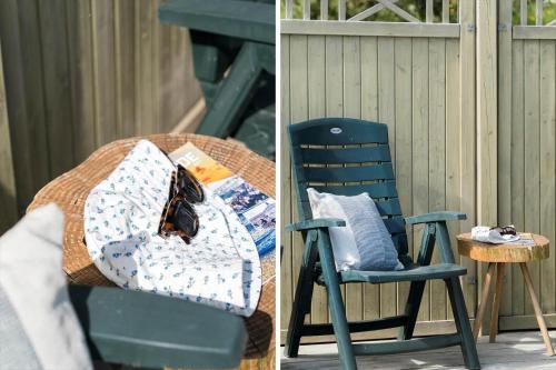 a green chair with a pillow and a table at G120-Lemvig-Gyvelvej-20 in Lemvig
