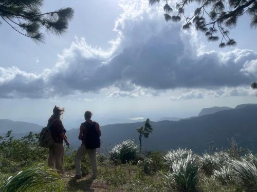 two people standing on a hill looking at the mountains at Meemure traval master in Meemure