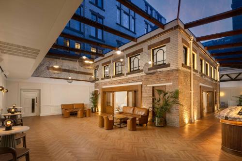 a large room with a large brick building at AC Hotel by Marriott Glasgow in Glasgow