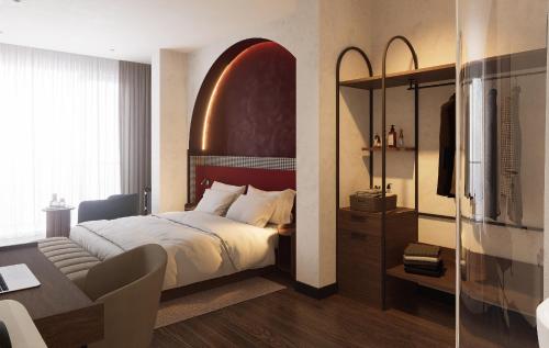 a hotel room with a bed and a desk and a bedroom at Kin Hotel Hai Ba Trung in Ho Chi Minh City