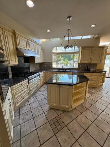 a large kitchen with a island in the middle at Luxurious and quiet room in Vancouver's West End in Vancouver