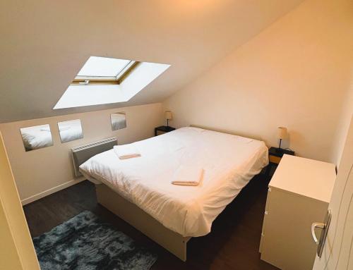 Ένα ή περισσότερα κρεβάτια σε δωμάτιο στο Guangzhoù - Suite moderne - 4P