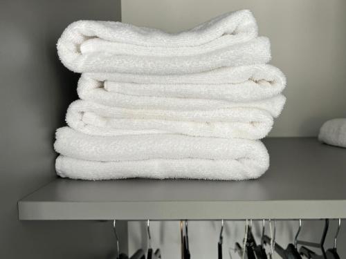 a stack of towels sitting on top of a table at Private 2 bed Apartment - Edinburgh - Sleeps 2 Max in Edinburgh