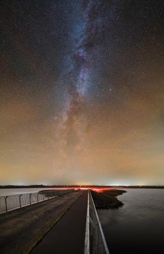 a night view of a pier with the milky way at Strågården Nyord in Nyord