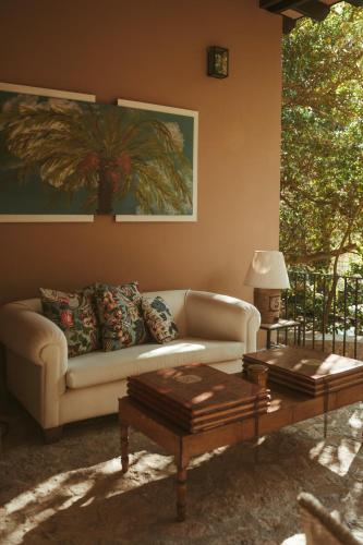 a living room with a couch and a coffee table at Rondaia, a Winery & Fincahotel-Agroturismo in Tramuntana in Esporles