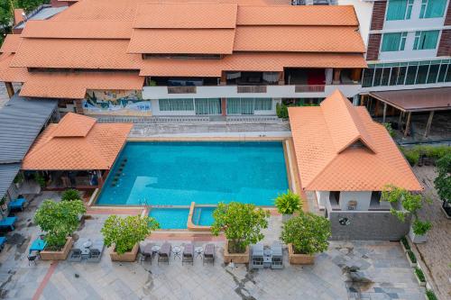 an overhead view of a swimming pool in front of a building at Khum Phucome Hotel -SHA Extra Plus in Chiang Mai
