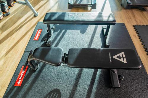a pair of treadmills sitting on a gym mat at Khum Phucome Hotel -SHA Extra Plus in Chiang Mai
