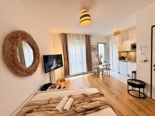 Ένα ή περισσότερα κρεβάτια σε δωμάτιο στο Le Studio Mail, Centre de Rennes