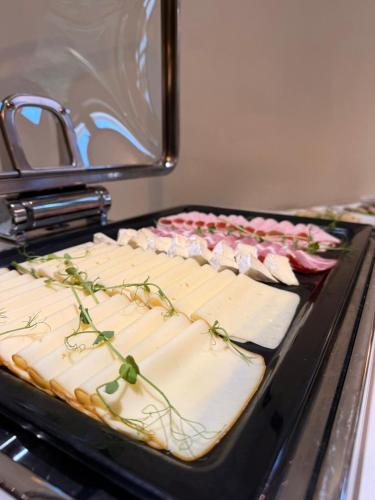 a group of sandwiches sitting on top of an oven at Hotel Gorczowski Katowice Chorzów in Chorzów