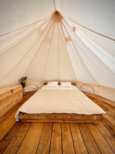 a bedroom with a bed in a tent at Jelena in Kutná Hora