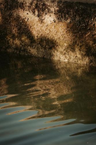 a reflection of a wall in the water at Rondaia, a Winery & Fincahotel-Agroturismo in Tramuntana in Esporles