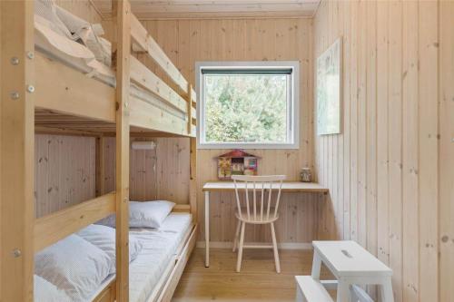 a bedroom with two bunk beds and a desk at 13370-Hojby-Havsbjergvej-11-A in Højby